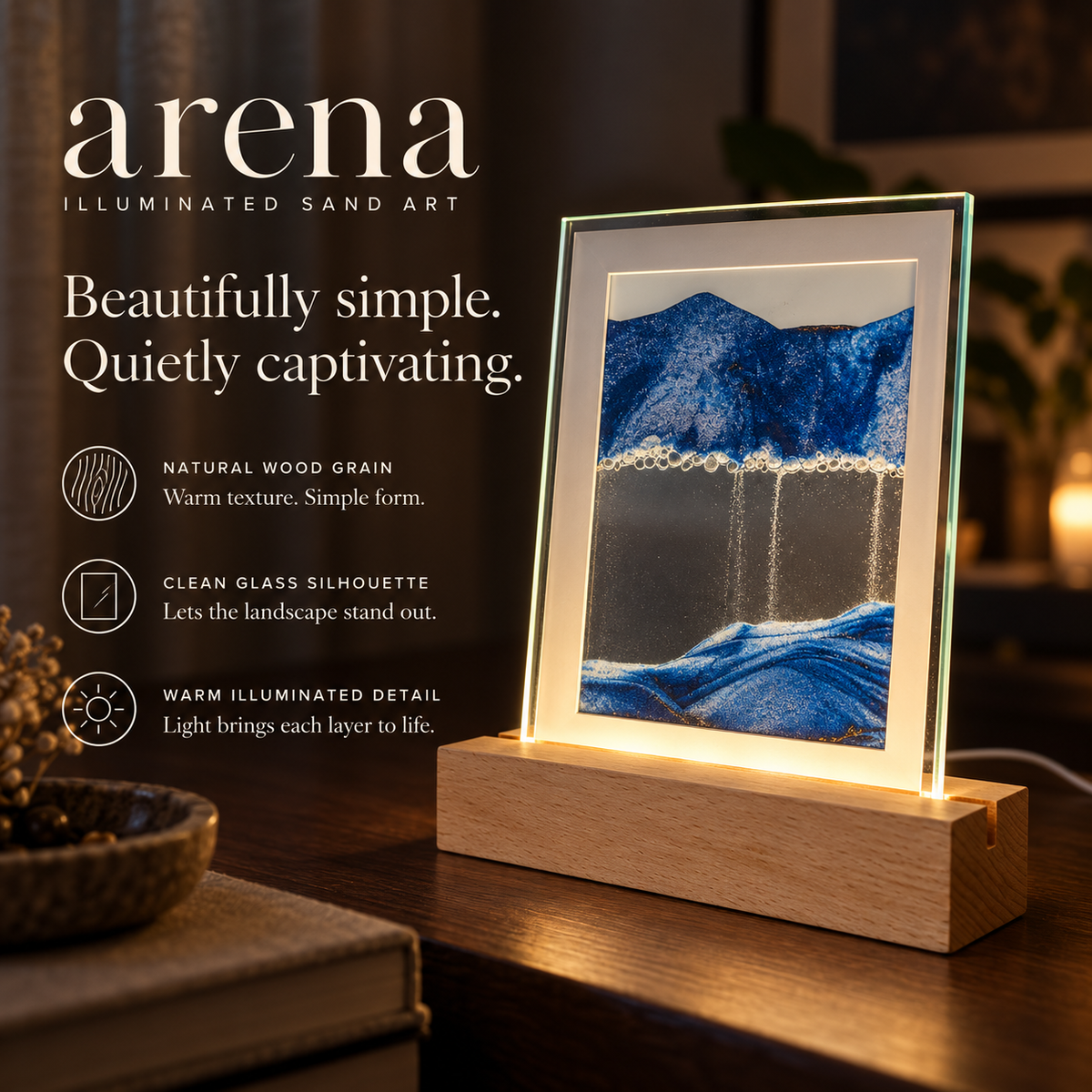 Arena blue sand art: natural wood grain, clean glass silhouette and warm illuminated detail.