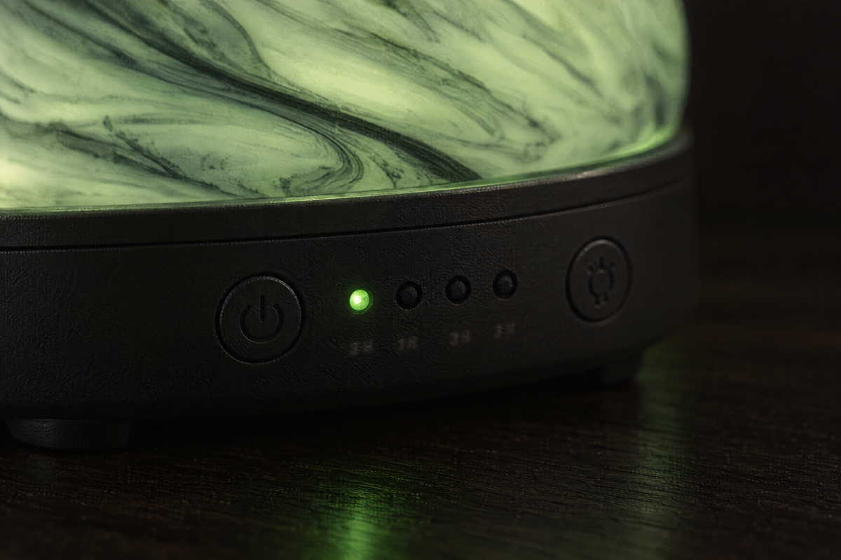 Close-up of Nebula's black base, light button and timer indicators