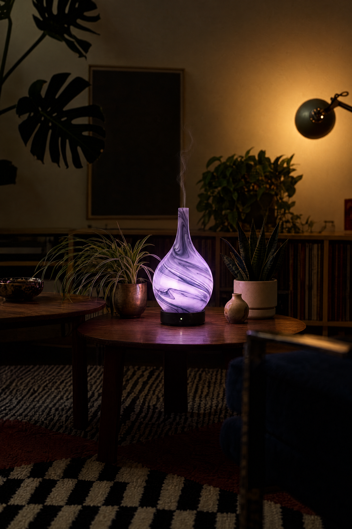Nebula glowing violet on a living-room table with a fine wisp of mist