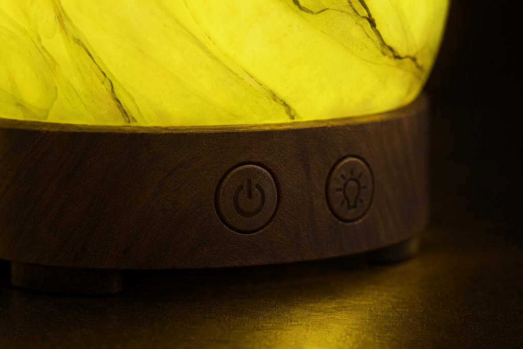 Close-up of the wood-effect base with mist and light buttons