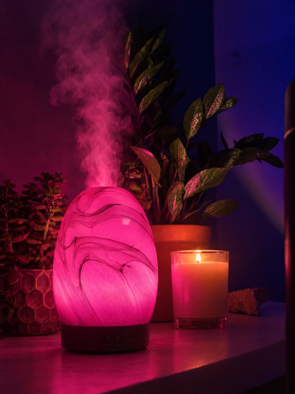 Astrum rounded marbled diffuser glowing pink with rising mist