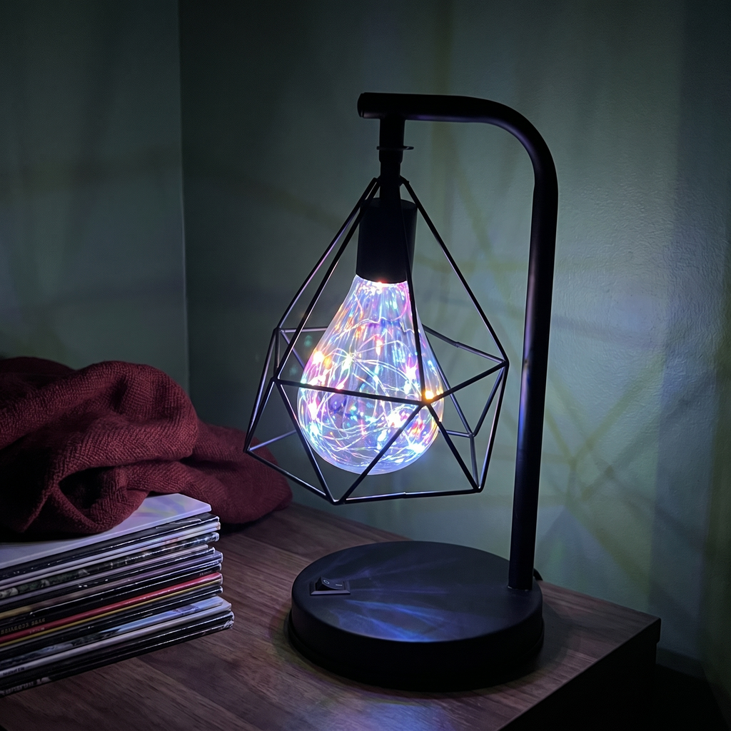 Glimmer colorful USB cage table lamp glowing on dark wood