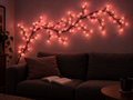 Sero pink blossom vine light above a sofa