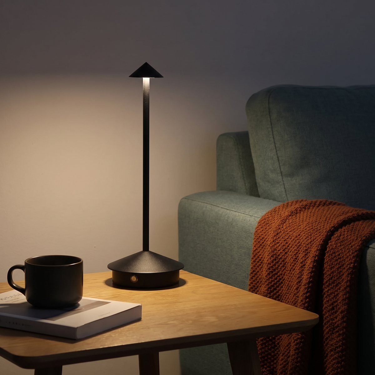 Black Spire cone table lamp in a cosy lived-in room